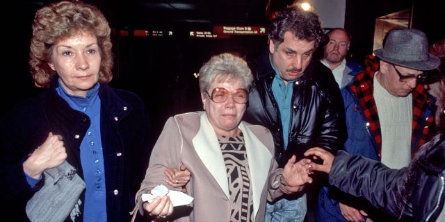 Families of victims of Pan Am 103 which crashed in Lockerbie, Scotland, due to a terrorist bomb, arrive at JFK Airport, New York, New York, December 21, 1988.