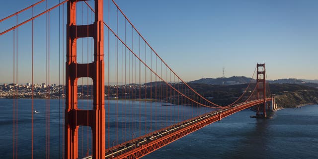 The Golden Gate Bridge is awash in warm light from the setting sun in San Francisco, California, on Feb. 13, 2015. 