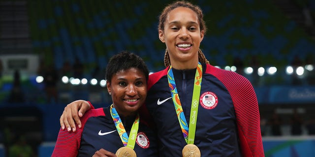 Gold medalists Angel Mccoughtry, #8, and Brittney Griner, #15 of the United States, celebrate during the medal ceremony after the Women's Basketball competition on Day 15 of the Rio 2016 Olympic Games at Carioca Arena 1 on Aug. 20, 2016 in Rio de Janeiro.