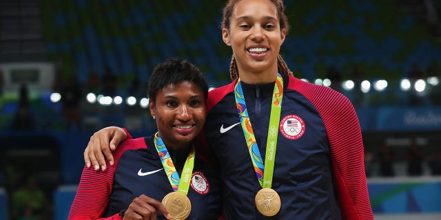 Gold medalists Angel Mccoughtry, #8, and Brittney Griner, #15 of the United States, celebrate during the medal ceremony after the Women's Basketball competition on Day 15 of the Rio 2016 Olympic Games at Carioca Arena 1 on Aug. 20, 2016 in Rio de Janeiro.