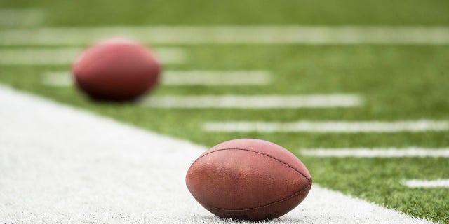 Footballs rest on the sideline before the game between the Buffalo Bills and the Jacksonville Jaguars on November 27, 2016, at New Era Field in Orchard Park, New York. 