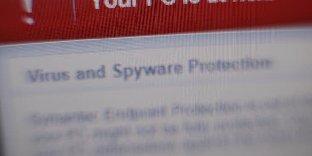 Virus and spyware warning messages on a laptop screen at home in London following a major cyber attack on NHS computer systems.