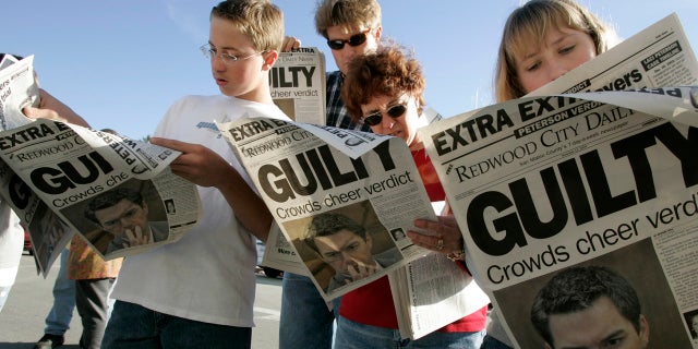 (L to R) Danny Lewin, Geoff Shenk, Katherine Lewin and Katie Lewin read the Extra edition put out by the Redwood City Daily News after the verdict was read in the Scott Peterson murder trial Nov. 12, 2004, in Redwood City, Calif.