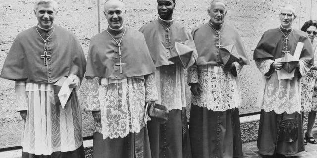 Five new cardinals created by the Pope at the Vatican, 27th June 1977. From left to right, they are Cardinal Joseph Ratzinger of Germany (later Pope Benedict XVI), Cardinal Giovanni Benelli, the former Vatican Under-Secretary of State, Cardinal Bernardin Gantin of Benin, Cardinal Frantisek Tomasek of Prague, and Cardinal Mario Luigi Ciappi, a Vatican theologian. 