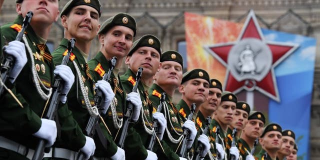 Russian servicemen march at Red Square during the general rehearsal of the Victory Day military parade in Moscow on May 6, 2018. - Russia marks the 73rd anniversary of the Soviet Union's victory over Nazi Germany in World War Two on May 9. (KIRILL KUDRYAVTSEV/AFP via Getty Images)