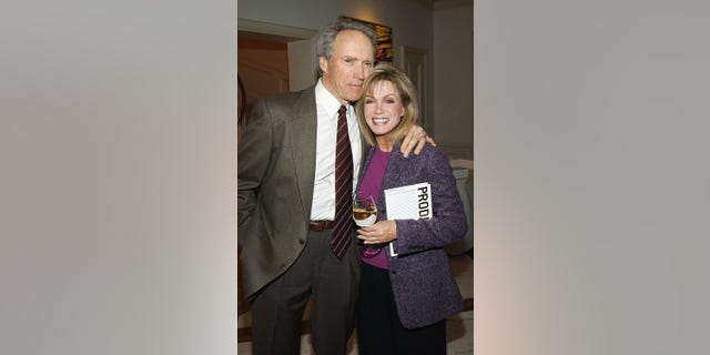 Clint Eastwood and Donna Mills attend a reception for producer David L. Wolper's bestselling memoir, "Producer" at the home of producer Bud Yorkin on April 29, 2003 in Beverly Hills, California. 