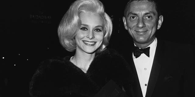 American film and television producer Aaron Spelling with actress Diane McBain at a party for the film "The Greatest Story Ever Told," circa 1965. 
