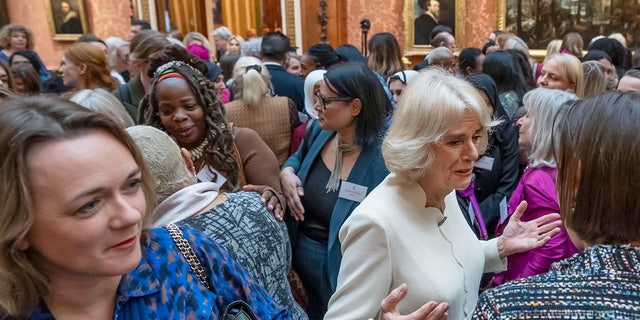 Camilla, queen consort, center right, hosts a reception attended by Ngozi Fulani, chief executive of the charity Sistah Space, center left, to raise awareness of violence against women and girls at Buckingham Palace Nov. 29, 2022, in London. 