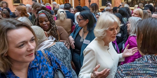 Camilla, queen consort, center right, hosts a reception attended by Ngozi Fulani, chief executive of the charity Sistah Space, center left, to raise awareness of violence against women and girls at Buckingham Palace Nov. 29, 2022, in London. 