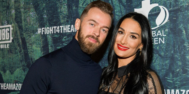 Artem Chigvintsev, left, and Nikki Bella said "I do" in August of this year.