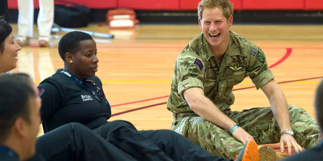 Prince Harry meets injured British soldiers as he attends the Warrior Games during the third day of his visit to the United States on May 11, 2013, in Colorado Springs, Colorado.