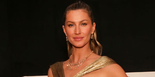 Gisele Bundchen wore a gold dress in first red carpet appearance post Tom Brady divorce.