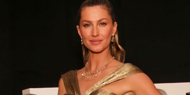 Gisele Bündchen wore a gold dress in her first red carpet appearance since her divorce from Tom Brady.