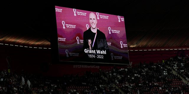 A tribute to journalist Grant Wahl is show on a screen before the World Cup quarterfinal soccer match between England and France, at the Al Bayt Stadium in Al Khor, Qatar, Saturday, Dec. 10, 2022. Wahl, one of the most well-known soccer writers in the United States, died early Saturday Dec. 10, 2022 while covering the World Cup match between Argentina and the Netherlands.