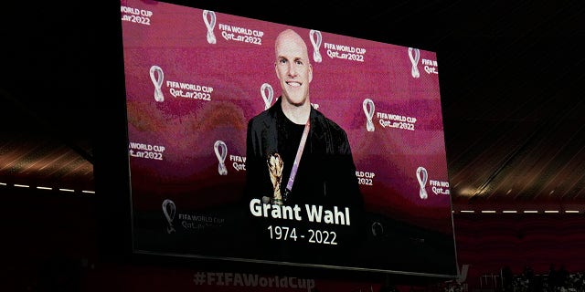 A tribute to journalist Grant Wahl is shown on screen before the World Cup quarterfinal match between England and France at Al Bayt Stadium in Al Khor, Qatar, Saturday, Dec. 10, 2022. Wahl, one of the most successful known soccer writers in the United States, died early on Saturday, Dec. 10, 2022, while covering Argentina vs. the Netherlands World Cup match.