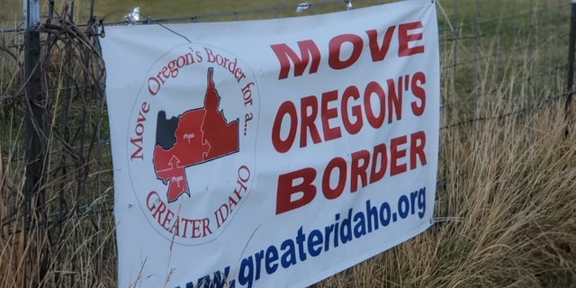 A rural sign advertises the Greater Idaho movement, which seeks to shift the border of Idaho westward to the Cascade Mountains in an effort to ease the political tension between Oregonians in the liberal Portland area and those in the rest of the state.