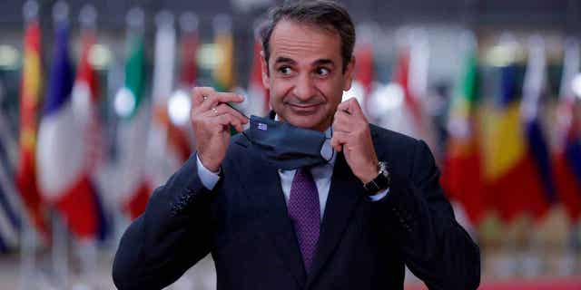 Greece's Prime Minister Kyriakos Mitsotakis arrives at the European Union summit at The European Council Building in Brussels on Oct. 2, 2020. Greek lawmakers are set to approve a plan that would outlaw commercial malware. Mitsotakis claims the reforms are 'a bold institutional response to a challenge that — and I want to emphasize this — does not only concern our country."