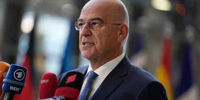 Greece's Foreign Minister Nikos Dendias speaks before a meeting of EU foreign ministers at the European Council building in Brussels, on Dec. 12, 2022. Dendias slammed Turkey for threats that were made toward Athens.