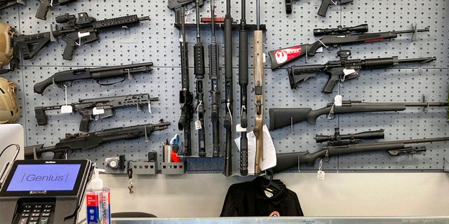 Firearms are displayed at a gun shop in Salem, Ore., on Feb. 19, 2021. 