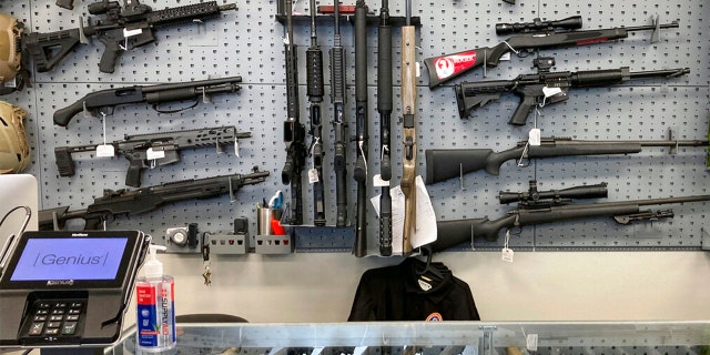 Firearms are displayed at a gun shop in Salem, Ore., on Feb. 19, 2021. 