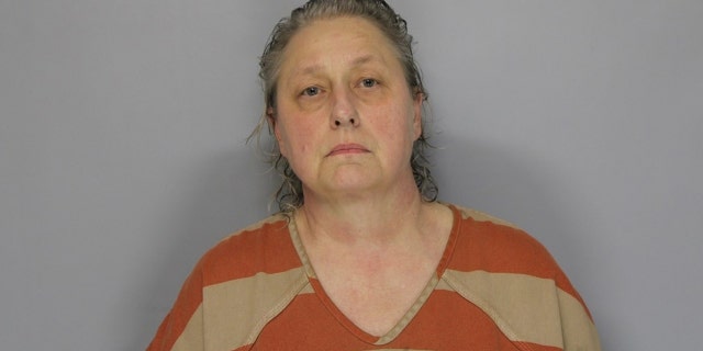 Fonda Spratt, 56, allegedly shot her neighbor twice over a complaint about barking dogs.