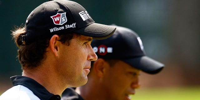 Padraig Harrington walks alongside Tiger Woods on the 16th hole during the third round of THE TOUR Championship presented by Coca-Cola, the final event of the PGA TOUR Playoffs for the FedEx Cup, at East Lake Golf Club in Atlanta on Sept. 26, 2009.