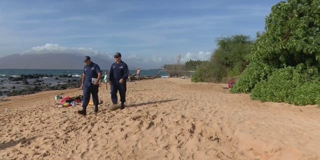First responders search Thursday for a woman whose husband said she went missing while snorkeling after he saw a shark in Maui, Hawaii.