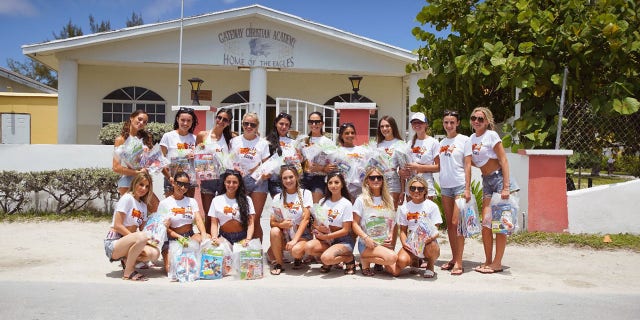 During this year’s calendar shoot, the models distributed coloring books, crayons, sunglasses and toiletries to children at Gateway Christian Academy in Bimini in the Bahamas.