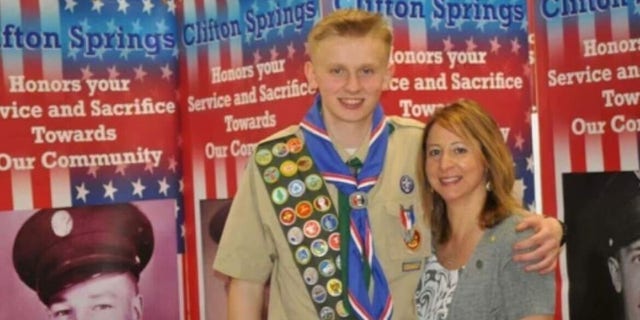 Ken DeLand, an American college student who disappeared in France, seen in his Eagle Scout uniform with his mother, Carol Laws. 