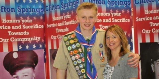 Ken DeLand, an American college student missing in France, seen in his Eagle Scout uniform with his mother, Carol Laws. 