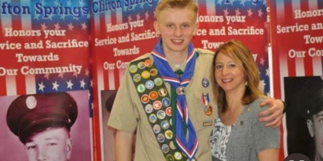 Ken DeLand, an American college student missing in France, seen in his Eagle Scout uniform with his mother, Carol Laws.