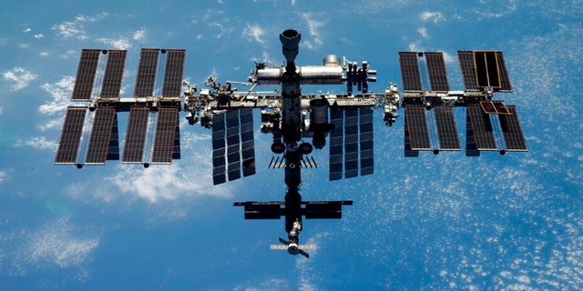 This undated handout photo released by Roscosmos State Space Corporation on Thursday, Dec. 15, 2022 shows the International Space Station (ISS) during its fly. 