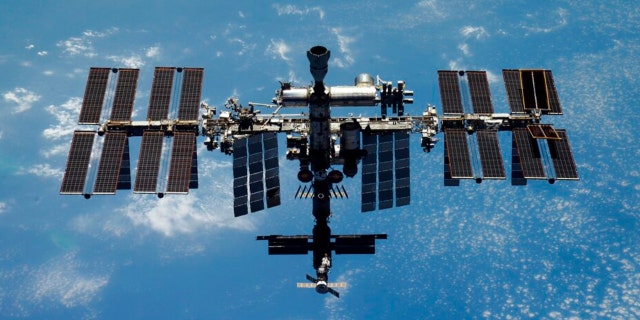 This undated handout photo released by Roscosmos State Space Corporation on Thursday, Dec. 15, 2022 shows the International Space Station (ISS) during its fly.