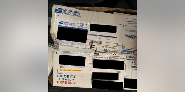Photos of ripped packages containing donor checks allegedly stolen by U.S. Postal Service Workers. (Photo provided by Elise Stefanik for Congress.)