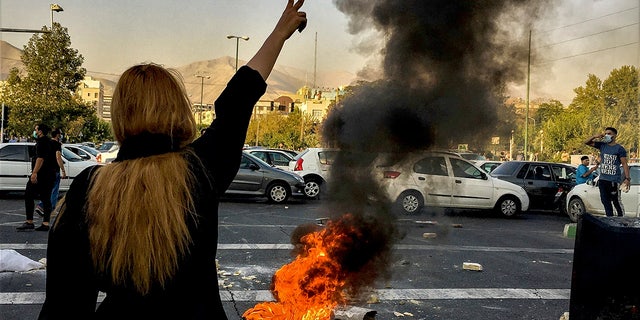 FILE: Iranians protests the death of 22-year-old Mahsa Amini after she was detained by the morality police, in Tehran, Oct. 1, 2022. 