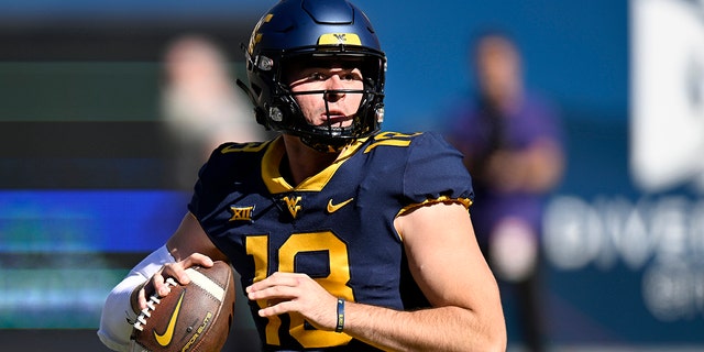 JT Daniels, #18 of the West Virginia Mountaineers, drops back to pass against the TCU Horned Frogs at Mountaineer Field on Oct. 29, 2022 in Morgantown, West Virginia.