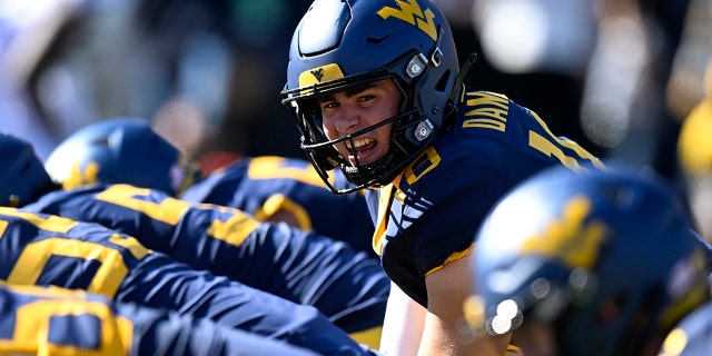JT Daniels, #18 of the West Virginia Mountaineers, calls a play against the TCU Horned Frogs at Mountaineer Field on Oct. 29, 2022 in Morgantown, West Virginia.
