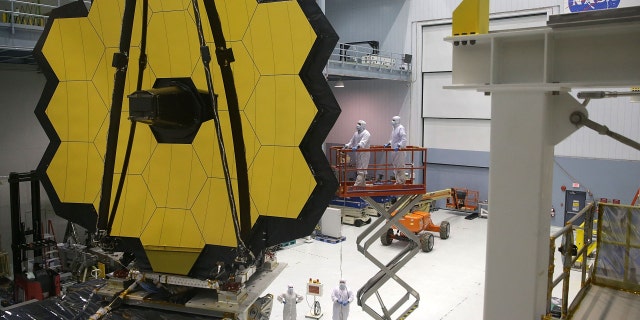 Engineers and technicians assemble the James Webb Space Telescope at NASA's Goddard Space Flight Center in Greenbelt, Maryland. 