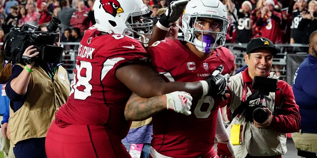 Arizona Cardinals running back James Conner (6) celebrates his touchdown with offensive tackle Kelvin Beachum against the Tampa Bay Buccaneers during the second half of an NFL football game, Sunday, Dec. 25, 2022, in Glendale, Ariz. 