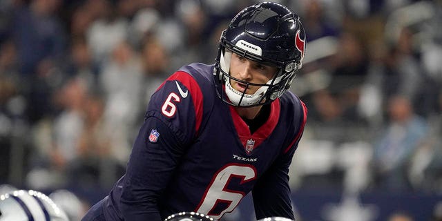 Jeff Driskel of the Houston Texans is under center during the first half of the Dallas Cowboys game, Dec. 11, 2022, in Arlington, Texas.