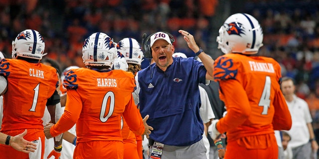 Head coach Jeff Traylor of the UTSA Roadrunners congratulates his team after a touchdown against the Texas Southern Tigers at the Alamodome on Sept. 24, 2022 in San Antonio.