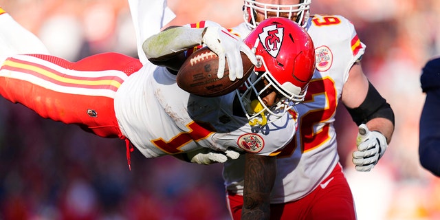 Kansas City Chiefs running back Jerick McKinnon leaps into the end zone for a touchdown during the first half of a game against the Denver Broncos Sunday, Dec. 11, 2022, in Denver. 