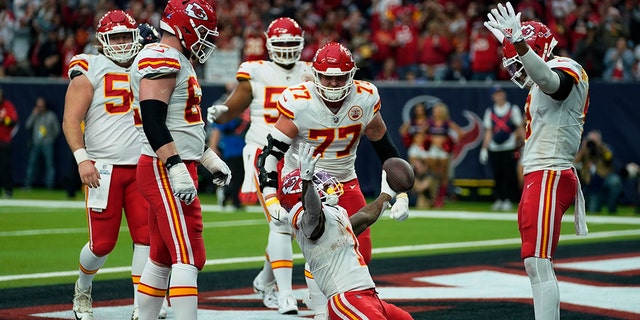 Kansas City Chiefs running back Jerick McKinnon (1) celebrates with teammates after making a catch for a two-point conversion during the second half of an NFL football game against the Houston Texans Sunday, Dec. 18, 2022, in Houston.