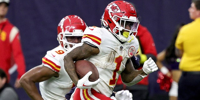 Jerick McKinnon, #1 of the Kansas City Chiefs, rushes for a touchdown during overtime against the Houston Texans at NRG Stadium on Dec. 18, 2022 in Houston.
