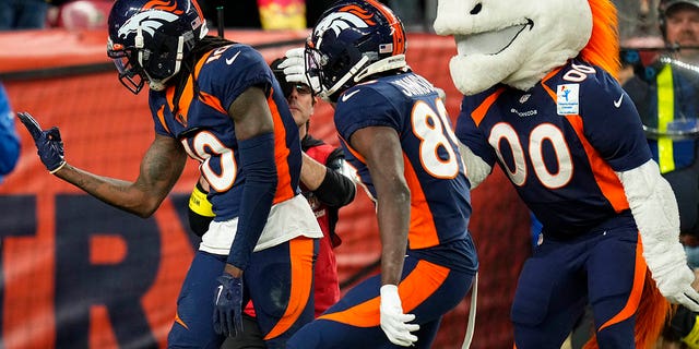 Denver Broncos wide receiver Jerry Jeudy, left, celebrates after making a touchdown catch during the second half of a game against the Kansas City Chiefs Sunday, Dec. 11, 2022, in Denver. 