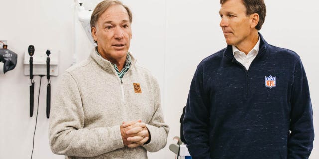 NFL Medical Adviser Dr. Jim Ellis, left, and NFL Chief Medical Officer Dr. Allen Sills brief health and safety staffs at the recent NFL game in London.