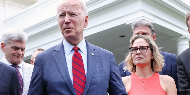 President Biden with Sen. Kyrsten Sinema, D-Ariz., after a bipartisan group of senators reached a deal on an infrastructure package at the White House June 24, 2021, in Washington.