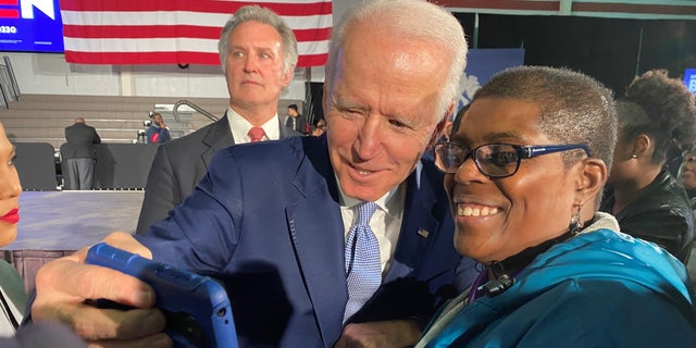 Then-former Vice President Joe Biden takes a selfie with a supporter in Columbia, South Carolina, after winning the state's Democratic presidential primary in a landslide, on Feb. 29, 2020.