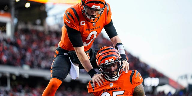 Bengals wide receiver Tee Higgins and quarterback Joe Burrow celebrate a touchdown against the Kansas City Chiefs in Cincinnati, Sunday, Dec. 4, 2022.