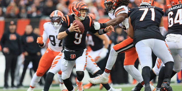 Cincinnati Bengals quarterback Joe Burrow (9) runs during the first half of an NFL football game against the Cleveland Browns, Sunday, Dec. 11, 2022, in Cincinnati. 